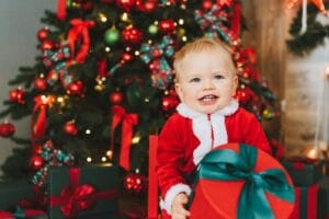 baby in red and white santa costume